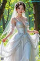 A woman in a wedding dress standing in the woods.